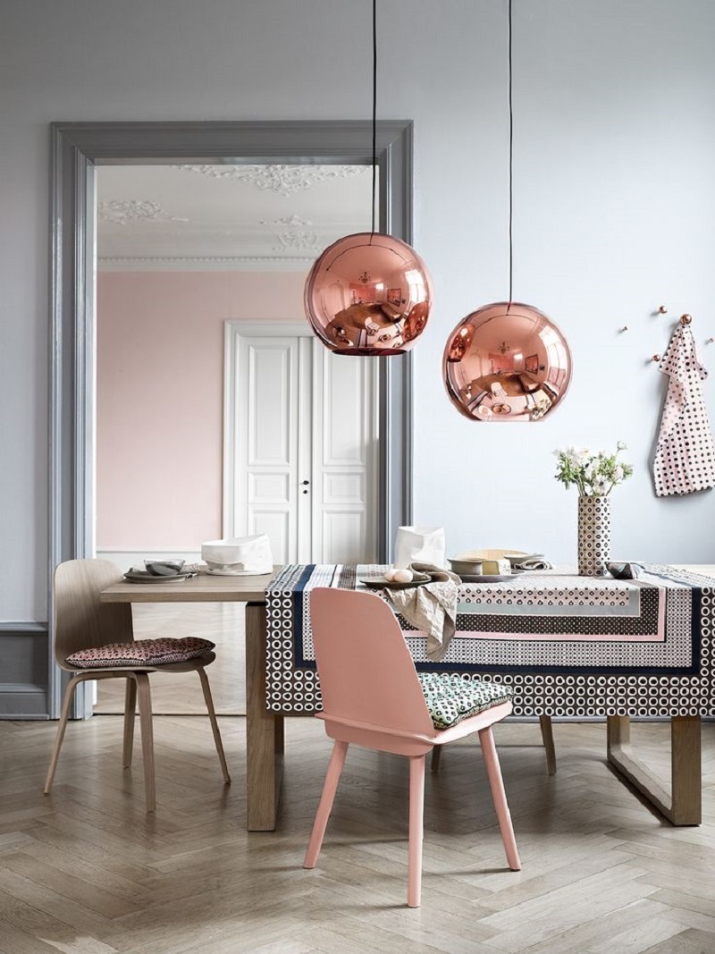 Copper sphere lighting over pink accent dining room table via Townsend London