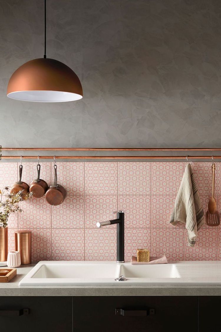 Kitchen with copper pendant and pink tile backsplash