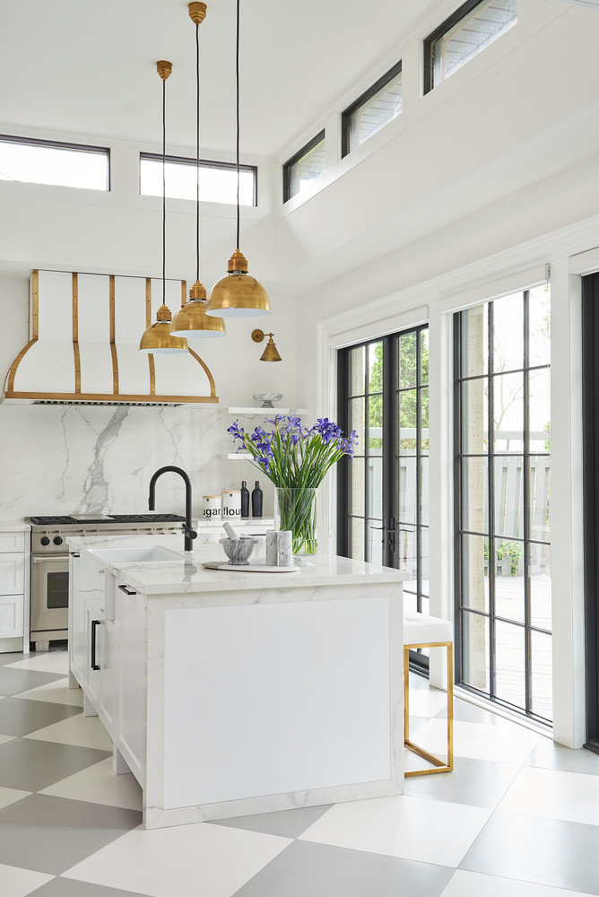 Brass Pendant Lights Above Marble Kitchen Island, marble backsplash, checkered kitchen flooring