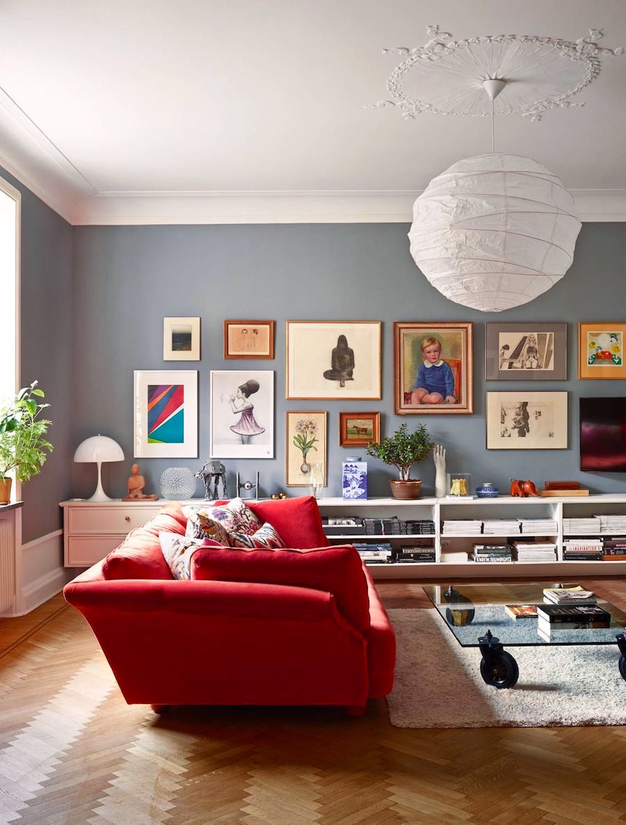 Red Sofa Ideas Herringbone Wood Flooring Gallery Wall via West Elm