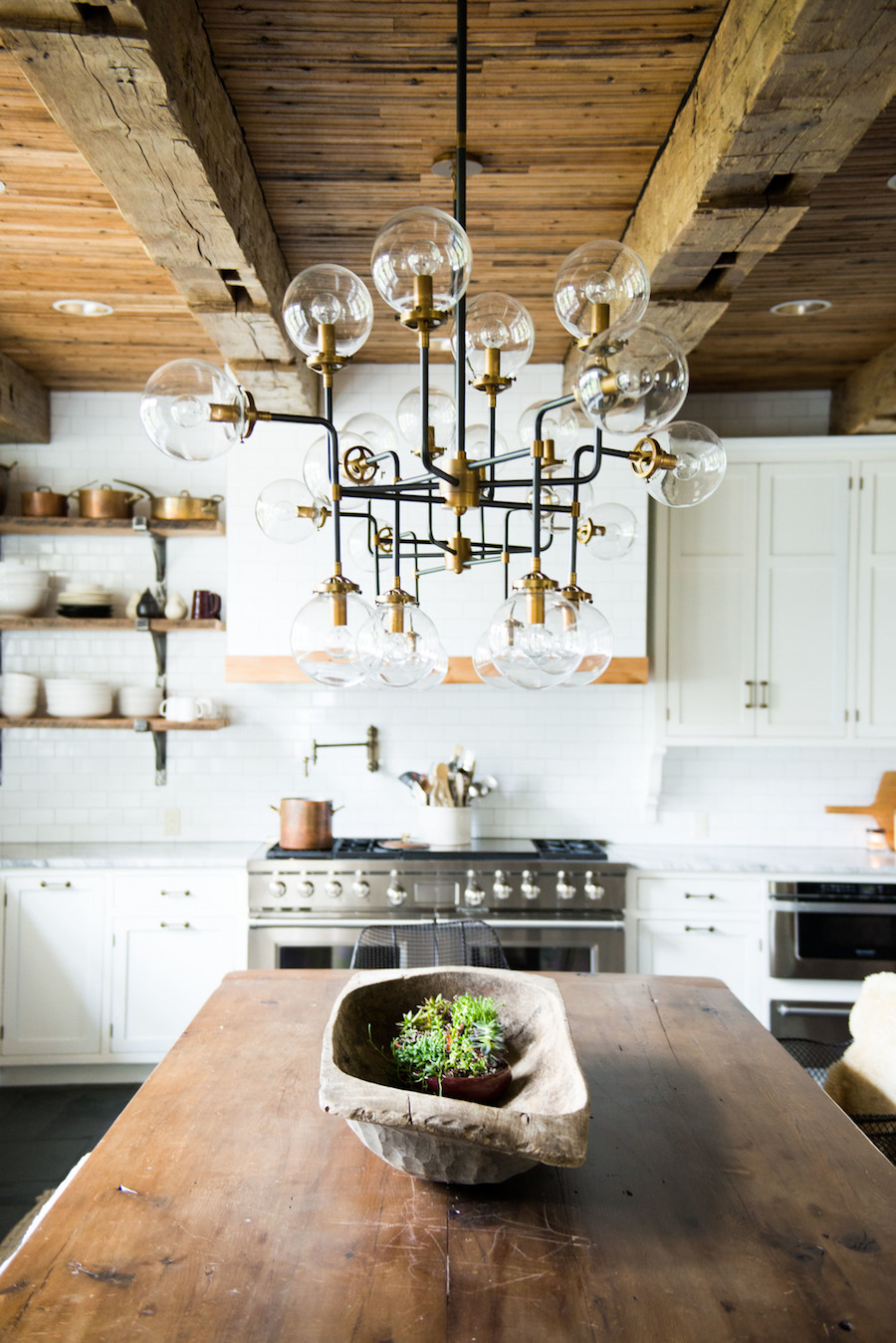 Rustic Wood Kitchen Island and Brass Chandelier with Real Wood Beam Ceiling via Midland Architecture