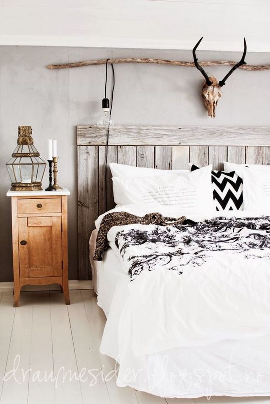 Rustic Wood Panel Headboard And Antlers