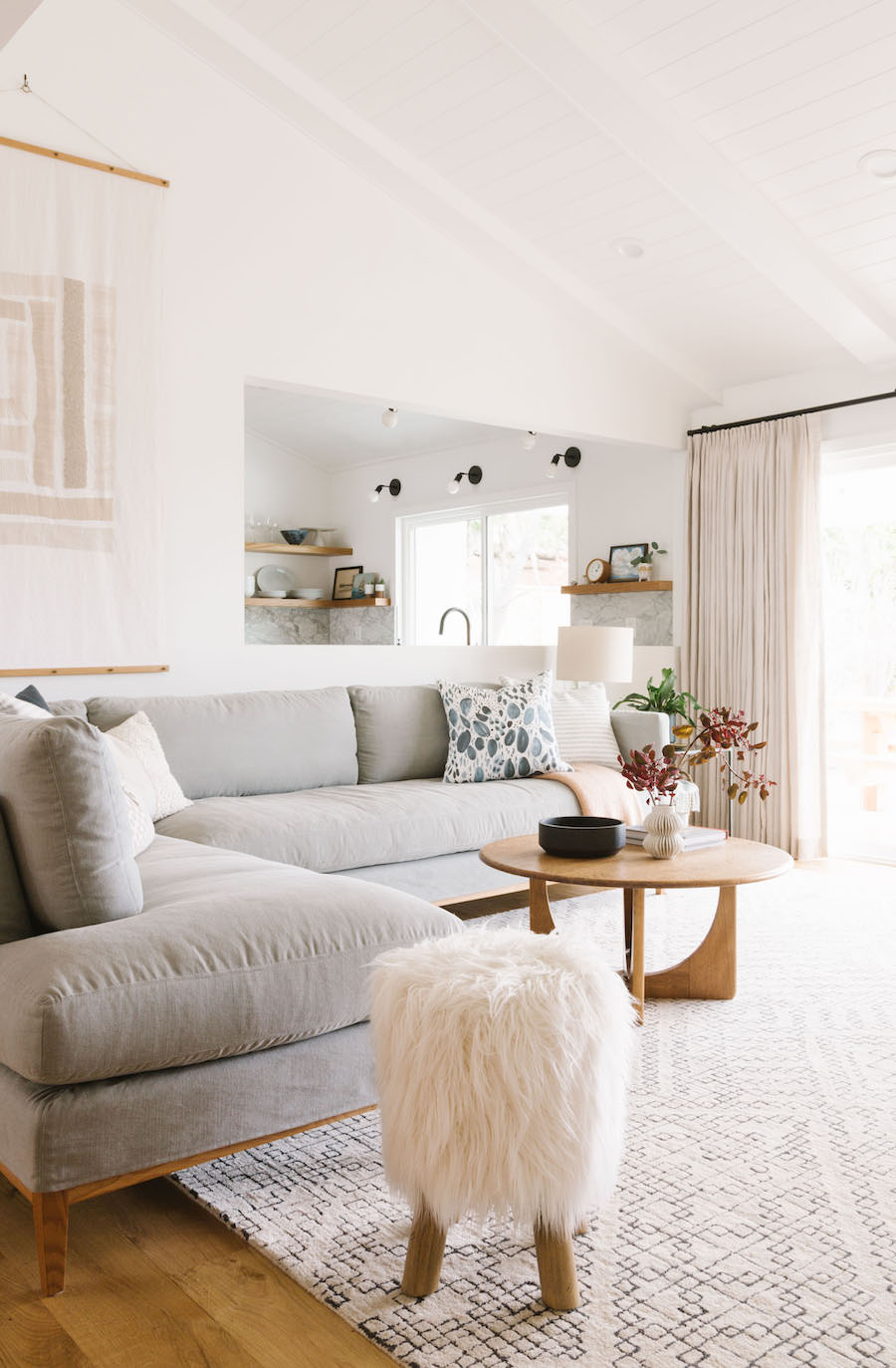 California Minimal Living Room With Light Grey Sofa And White Fur Side Stool