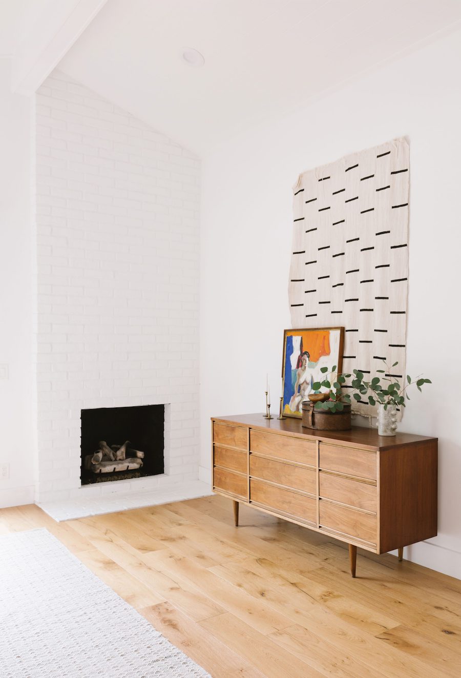 Mid Century Sideboard Next To Fireplace