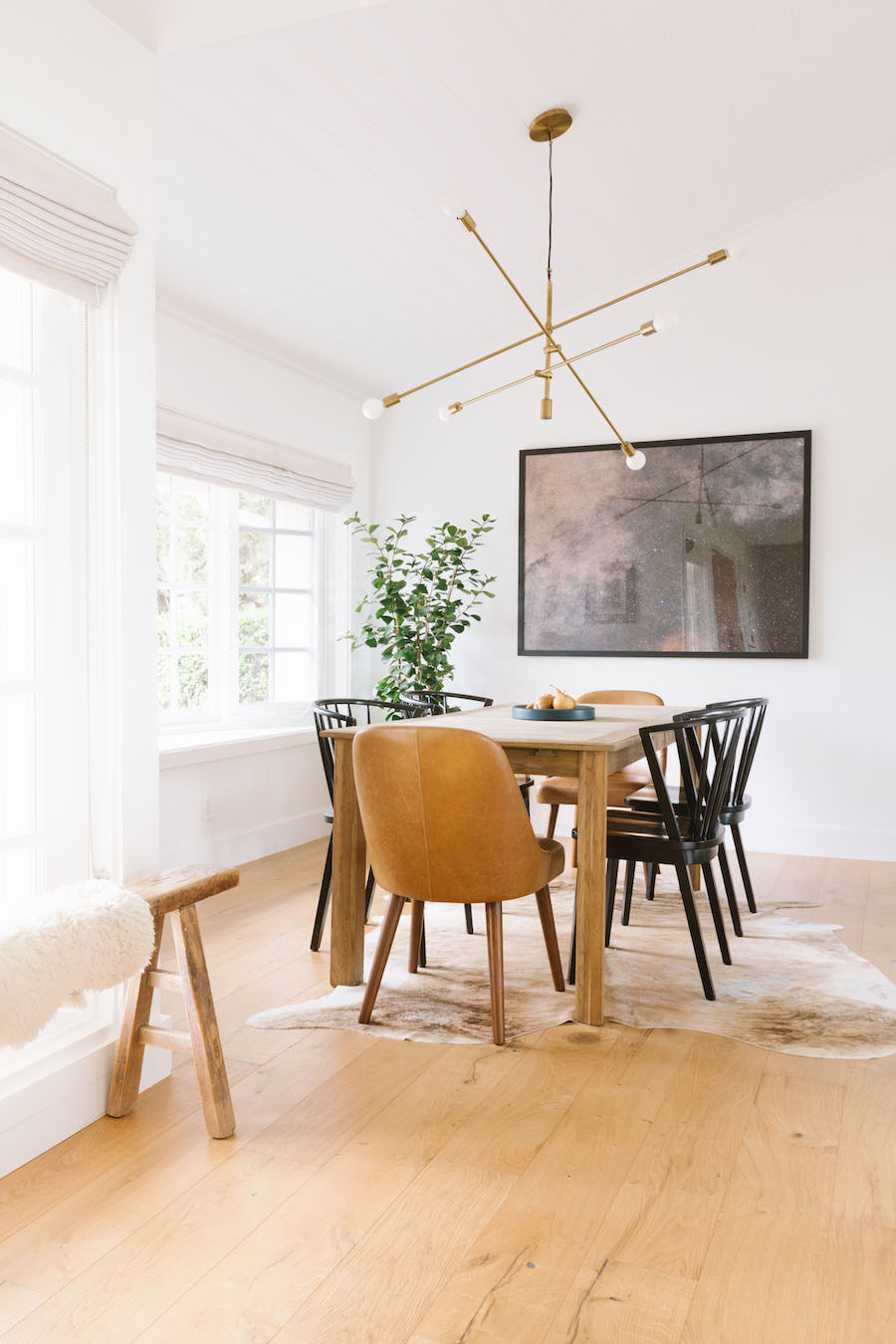 Scandinavian Minimal Dining Room With Leather Chair And Soft Brown Tones