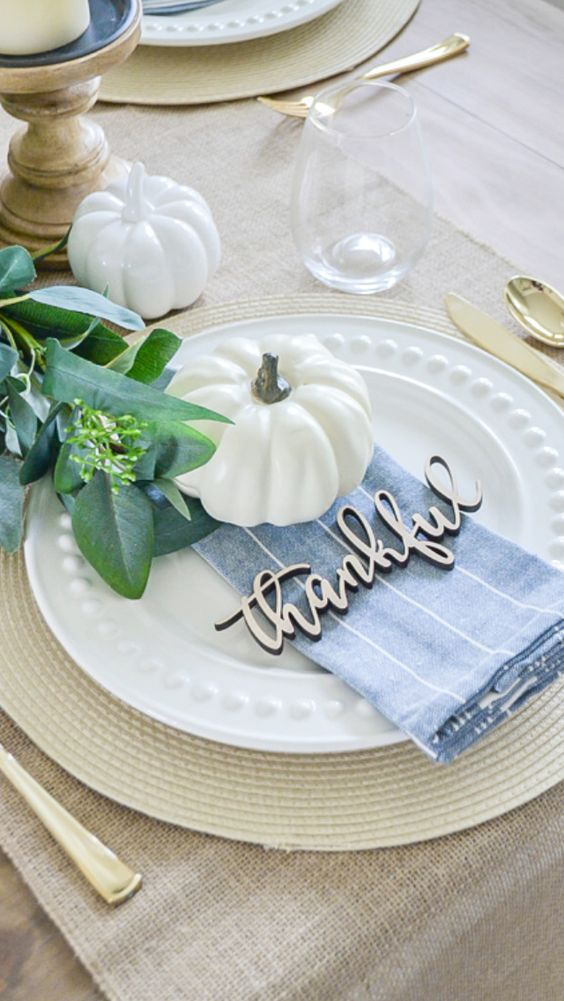 Thankful Place Setting With Small White Pumpkin Thanksgiving Table Decor via Julie Warnock Interiors