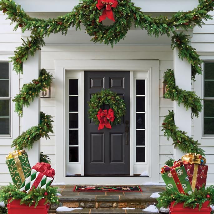 Black front door Christmas decor via Frontgate