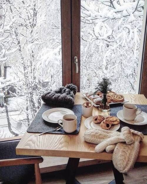 Breakfast nook overlooking a snowy forest