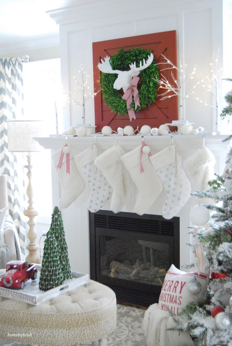 Christmas Mantel with Red Barn Door and White Stockings via 11magnolialane