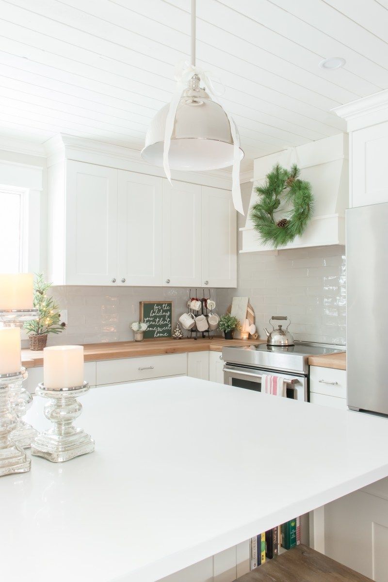 Evergreen Wreath Hanging on the Range Hood via makingitinthemountains