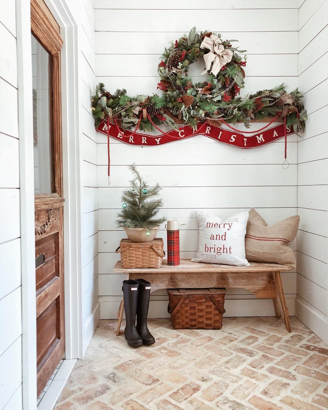 Festive Christmas wreath with Wooden Farmhouse Bench at the Entryway @whitetailfarmhouse #ChristmasDecor #ChristmasHome