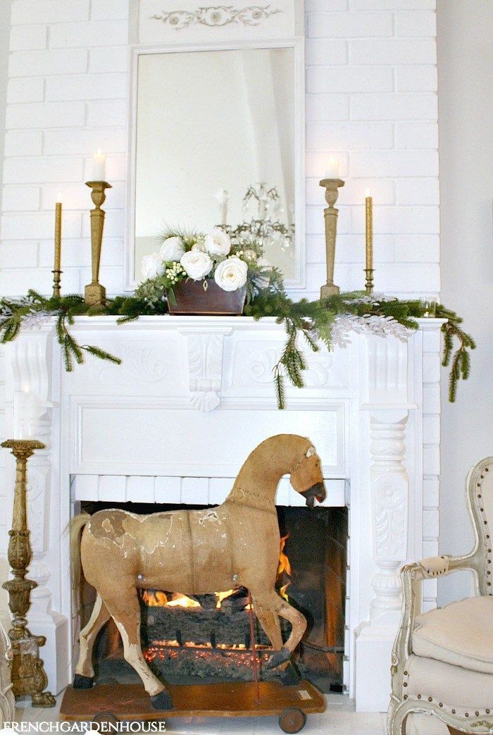 French Country Christmas Decor with Antique Horse and Fireplace via frenchgardenhouse #FrenchCountry #FrenchChristmas #FrenchCountryDecor