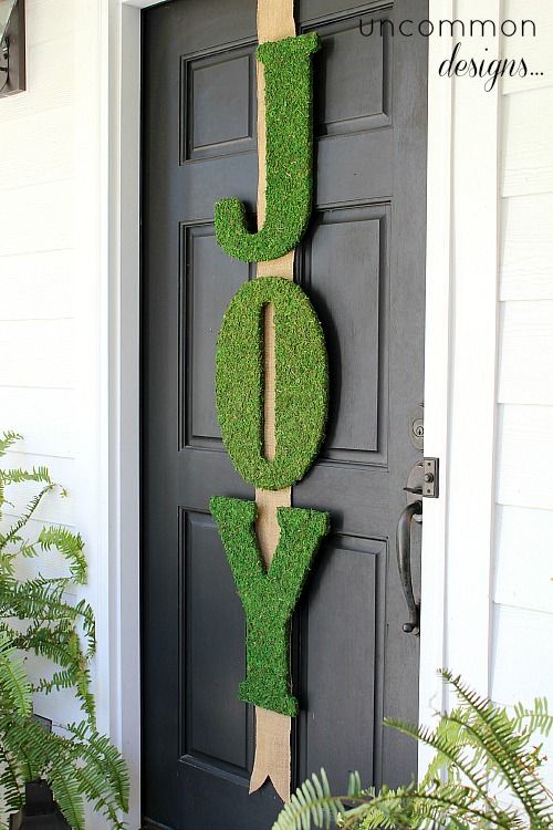 JOY sign on front door for Christmas