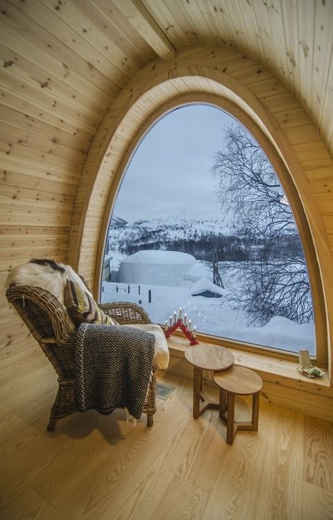 Reading Chair with Arched Window overlooking Snowy Mountains