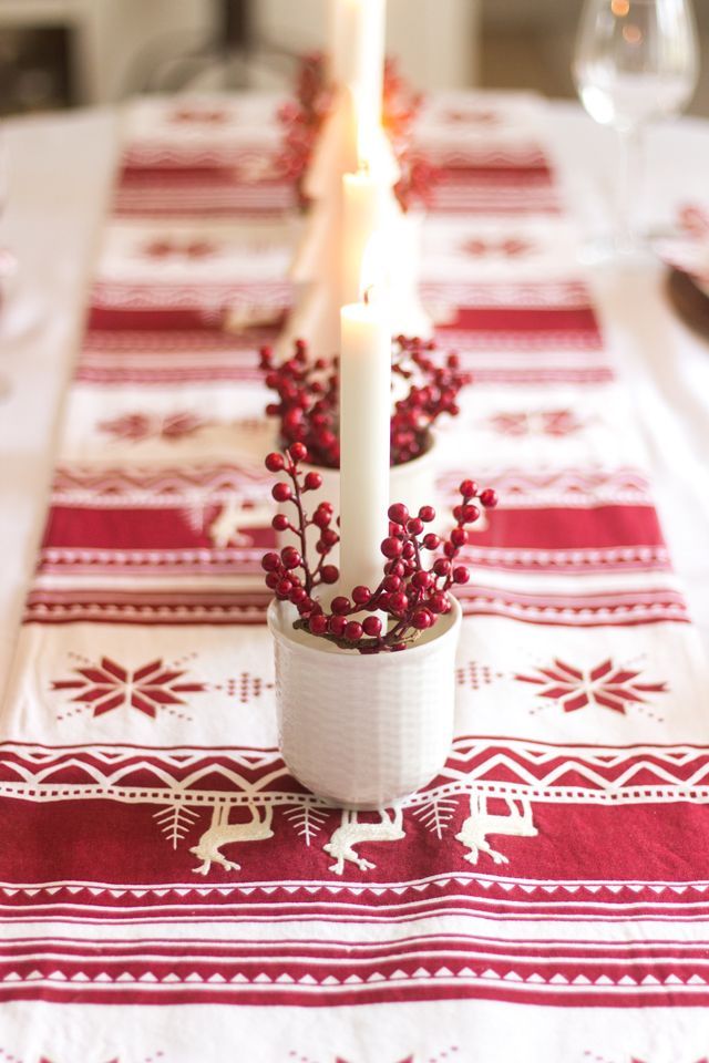 Red and white candle tablescape for Christmas via shadesofblueinteriors