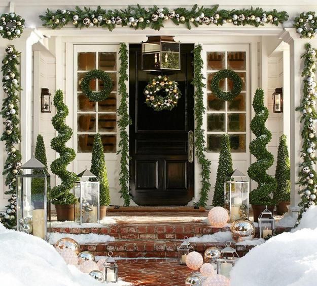 Silver ornaments and green garlands Front Porch decor for Christmas