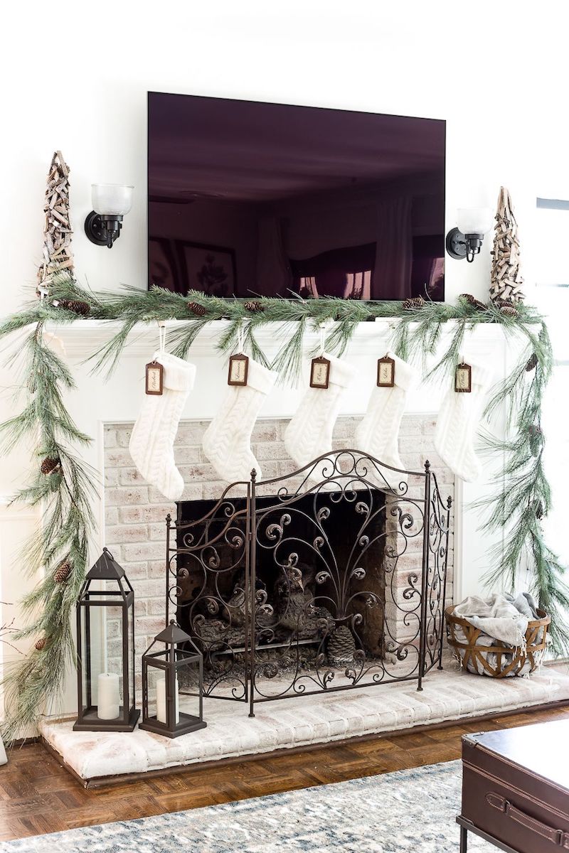 Christmas and New Year White and Silver Decorations on Fireplace