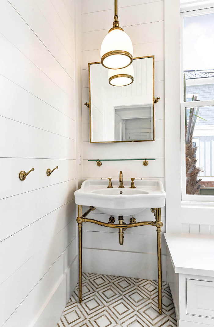 Bathroom with shiplap walls, Yildiz marble mosaic floor tile and brass bathroom vanity