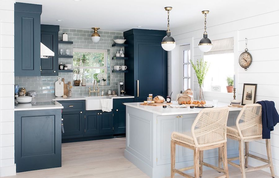 Dark blue kitchen cabinets in a blue beach home