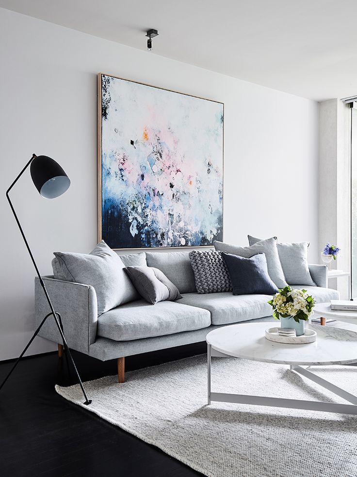 Light Gray Sofa with Abstract Art and White Marble Coffee Table