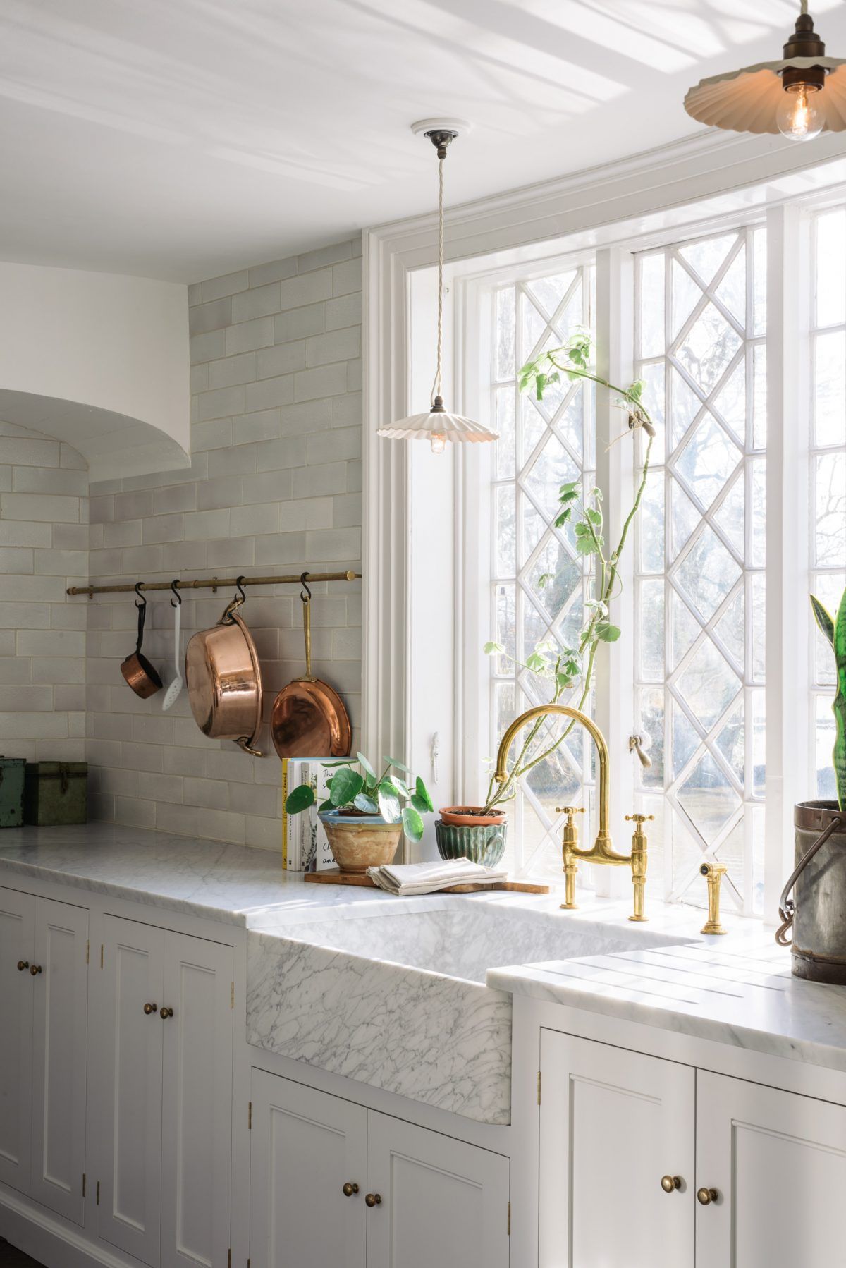 Marble kitchen sink via DeVol Kitchens with Copper Pots and Pans