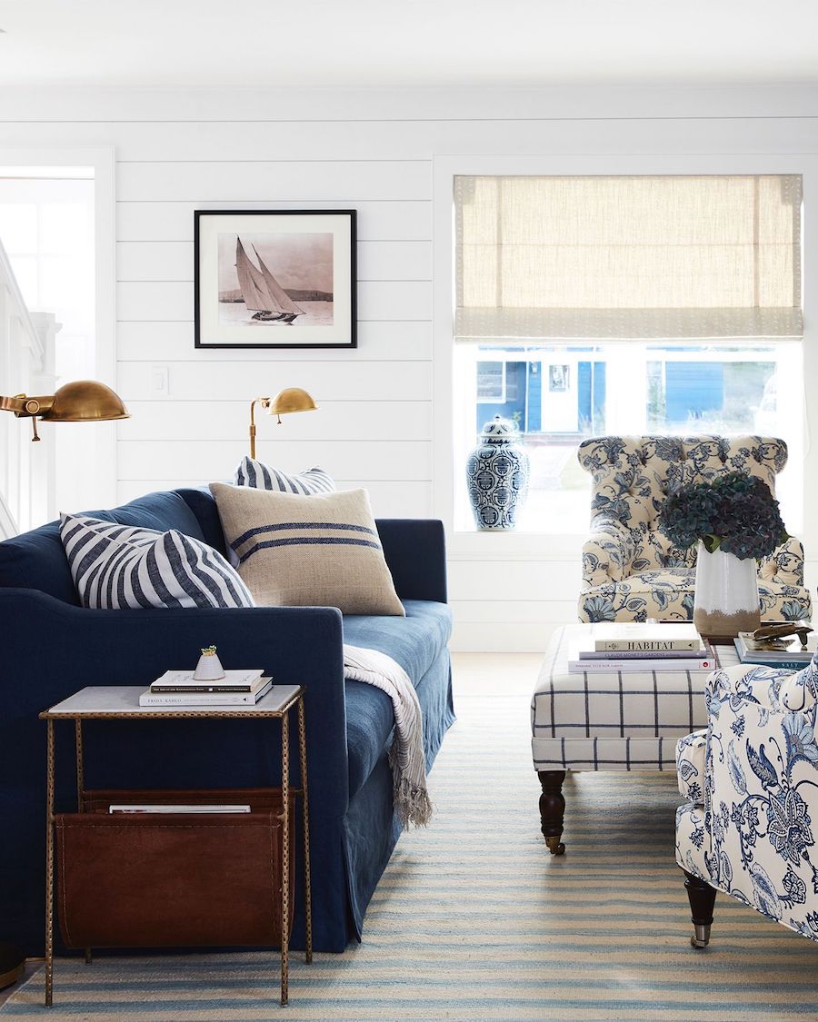 Modern nautical living room with navy sofa