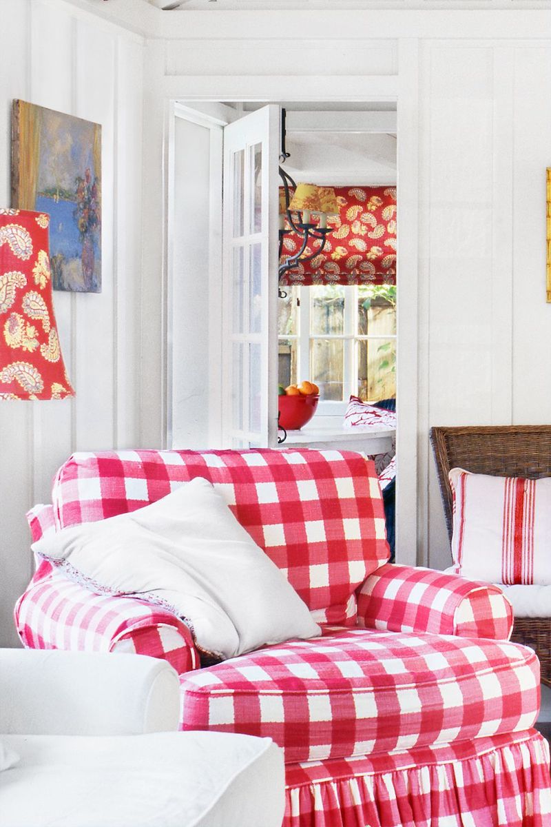 Red plaid accent chair in country living room via @countryliving