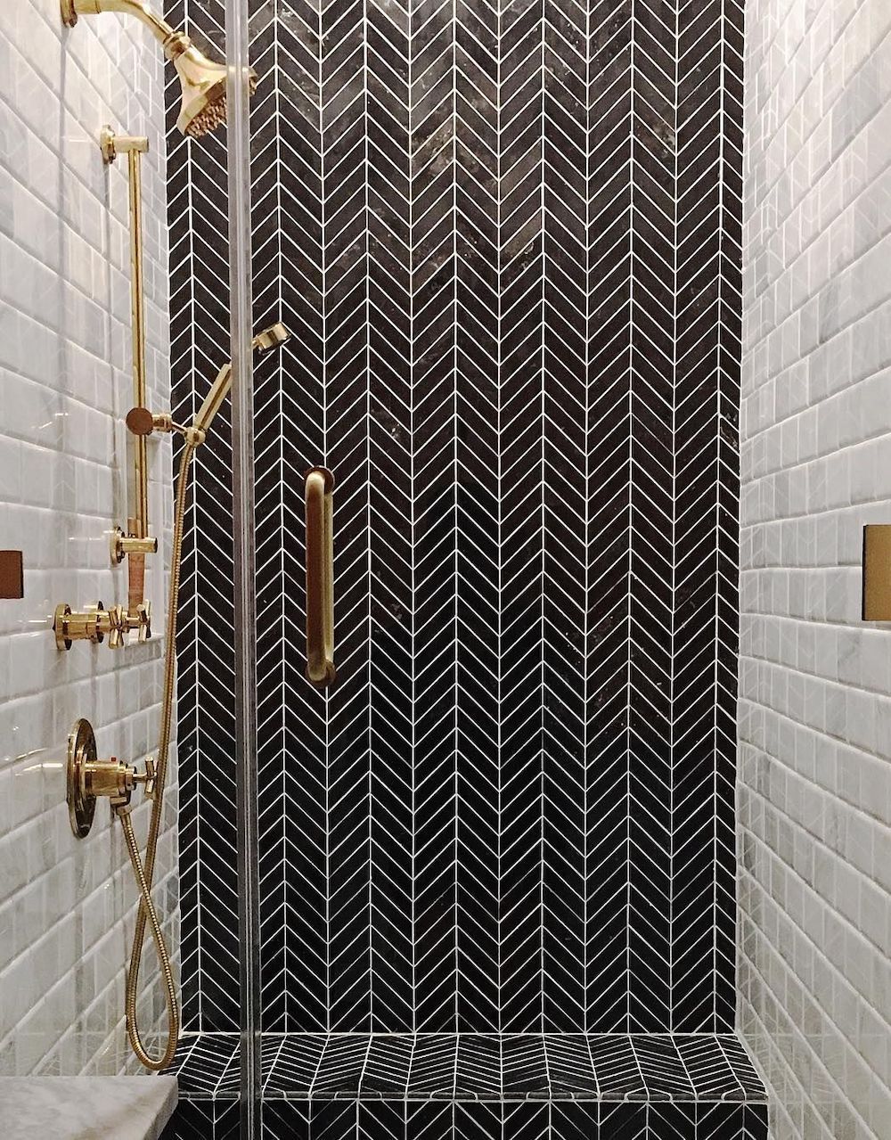 Bathrooms with Black Herringbone wall Tiles @jordansvaughn