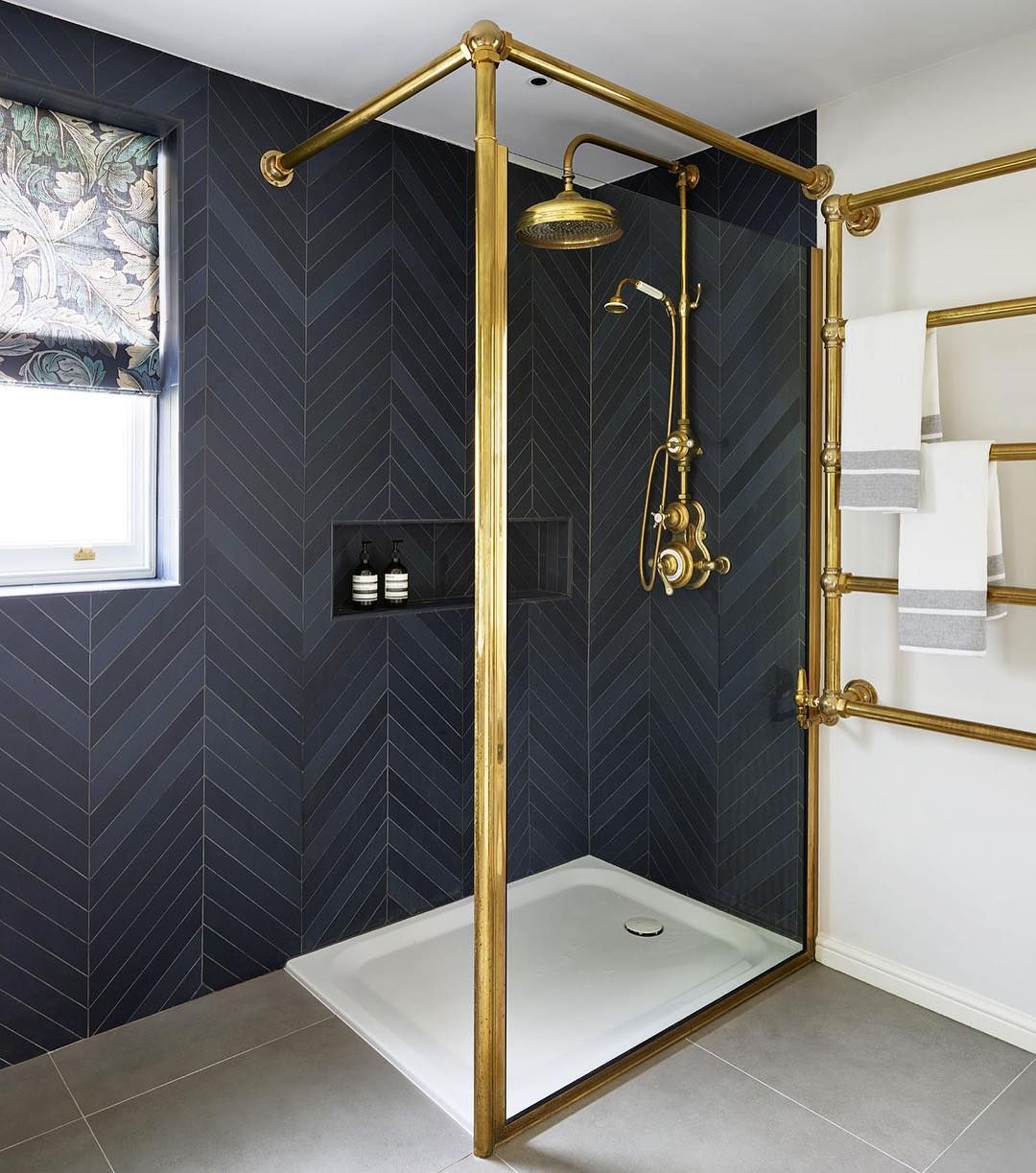 Bathroom with Black Chevron Herringbone tiles on wall via @drummonds_bathrooms