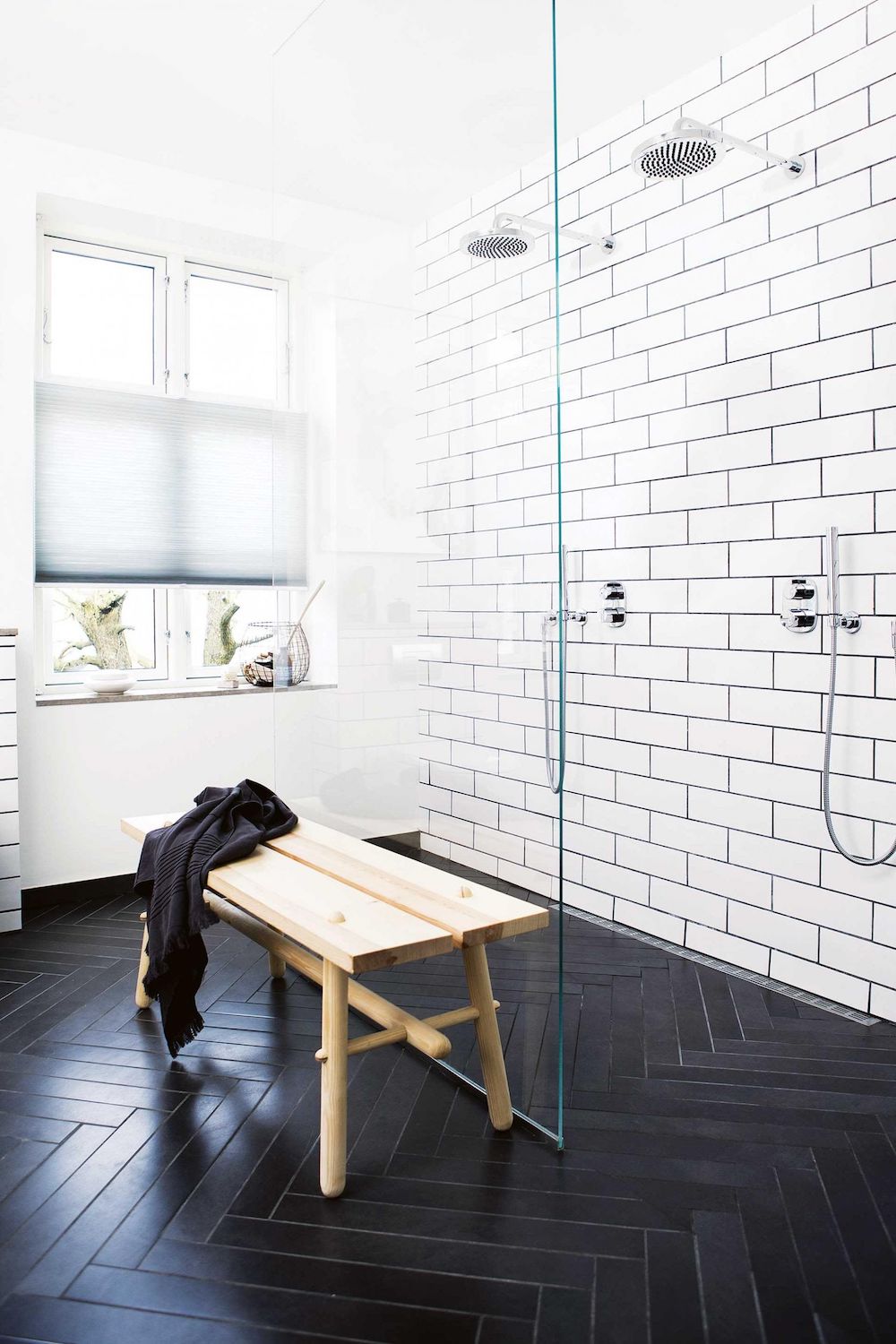 Bathrooms with Black Herringbone Floor tiles via Inside Out