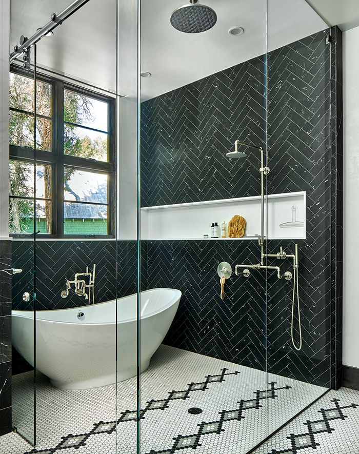 Bathrooms with Black Herringbone wall tiles via mountainliving