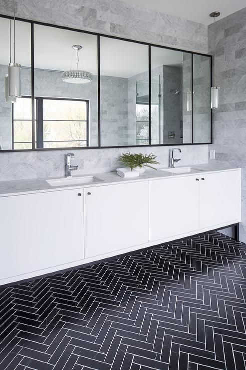 Bathrooms with black herringbone tiles on floor via Martha O'hara interiors