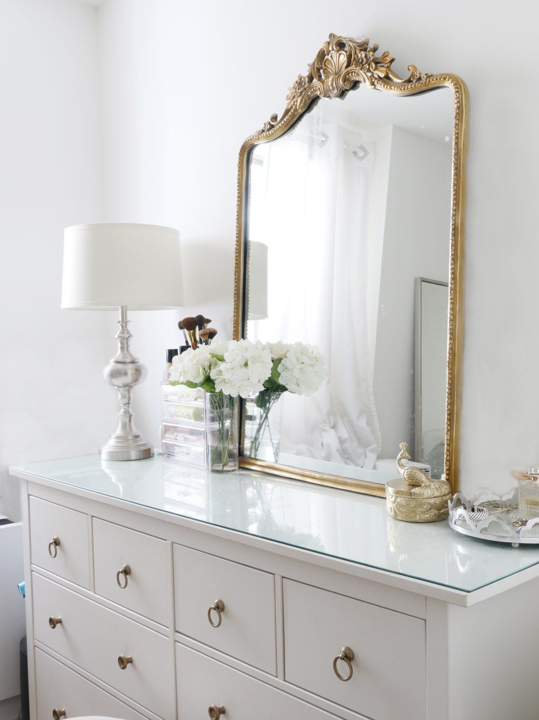 Bedroom Dresser Decor with gold Parisian mirror and silver table lamp via citychicdecor