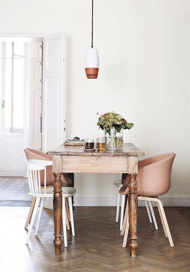 Eclectic dining room with wood dining table