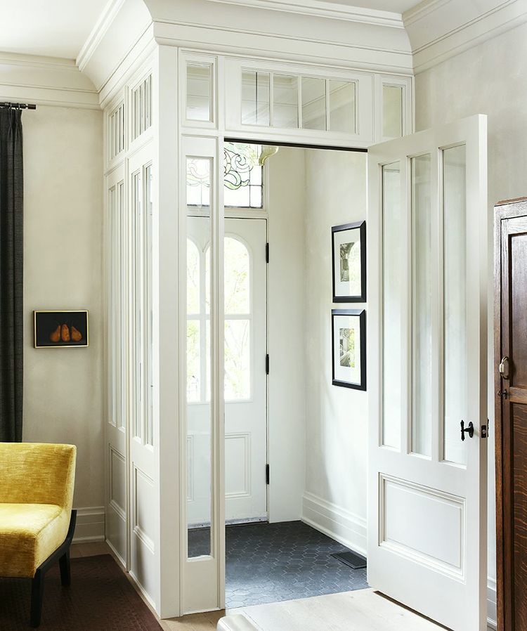 Enclosed entryway with glass windows via Douglas Design Studio