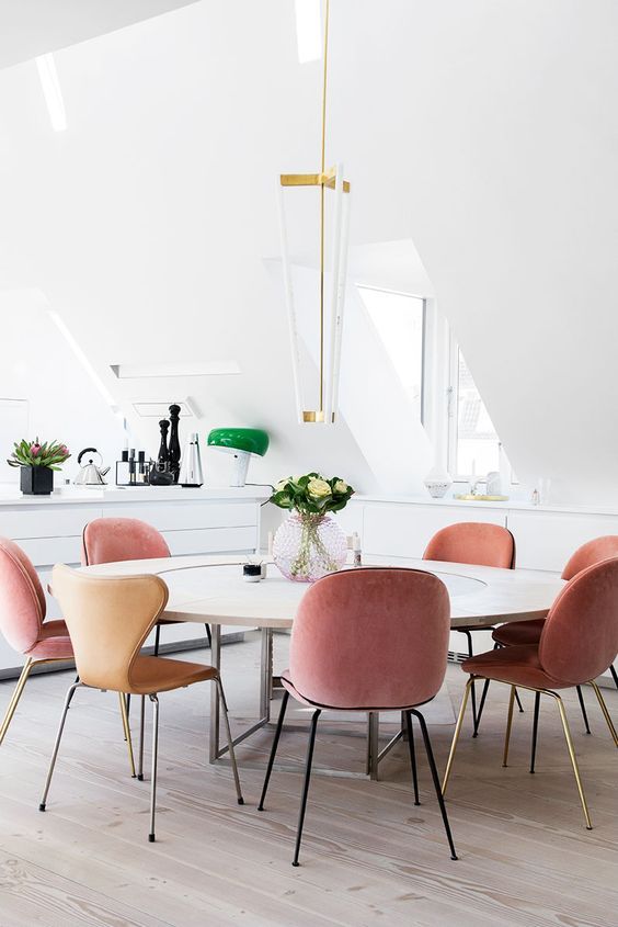 Pink velvet dining chairs in modern dining room