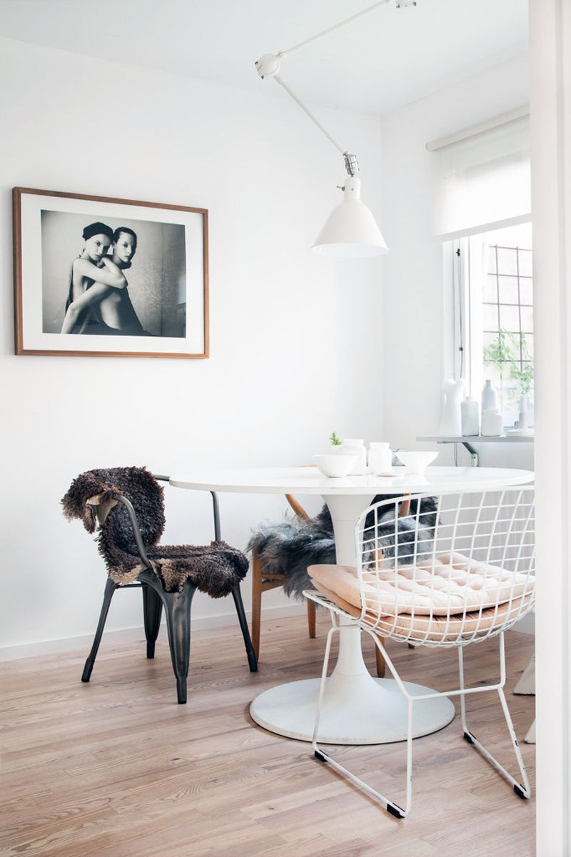 Scandinavian Dining Room with sheepskin throws on metal dining chairs, Sofie Sykfont