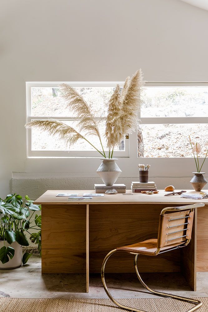 Scandinavian Home Office with Pampas Grass and wood desk via thisrepresents