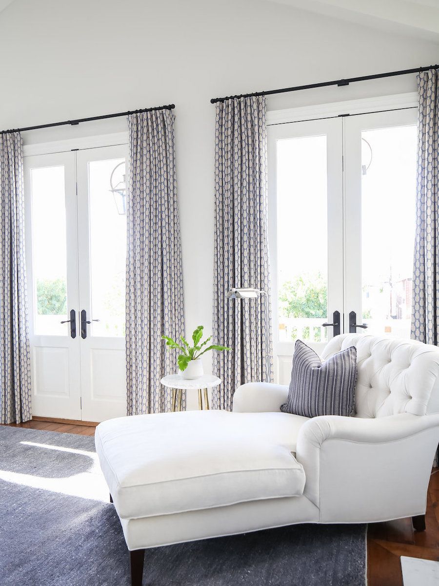 White tufted chaise lounge via Brooke Wagner Design