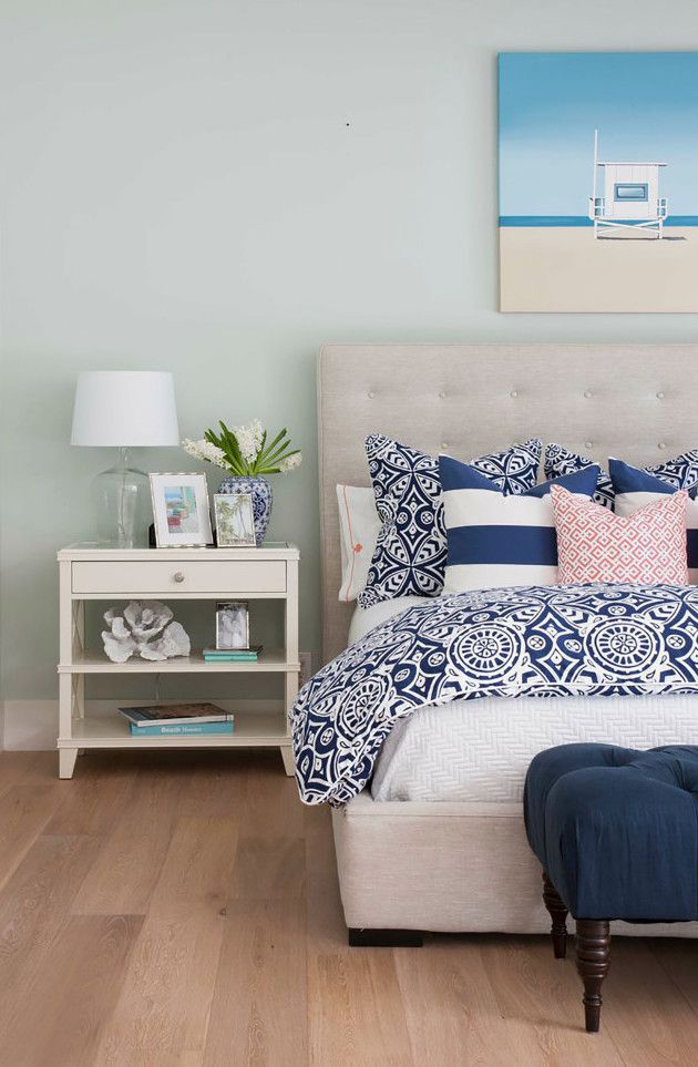 Coastal Bedroom with beige linen tufted headboard via AGK Design Studio