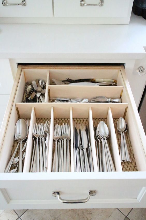 Use built-in dividers for utensil drawers