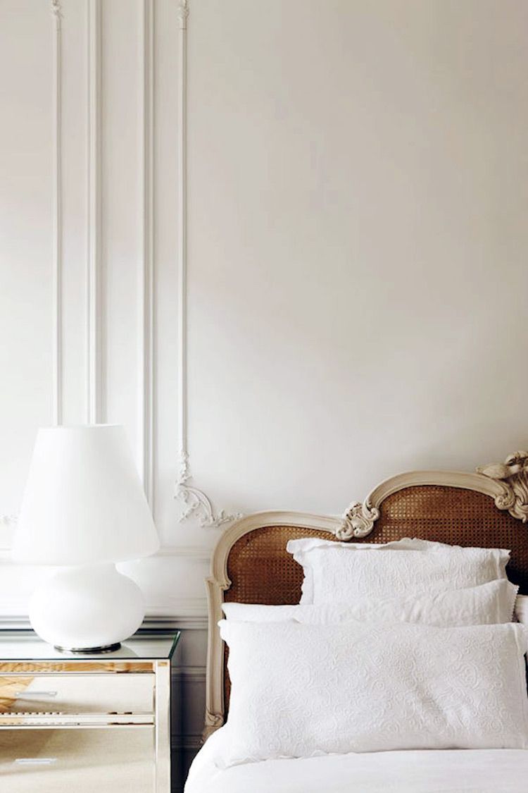 Parisian bedroom with Cane headboard and mirrored nightstand