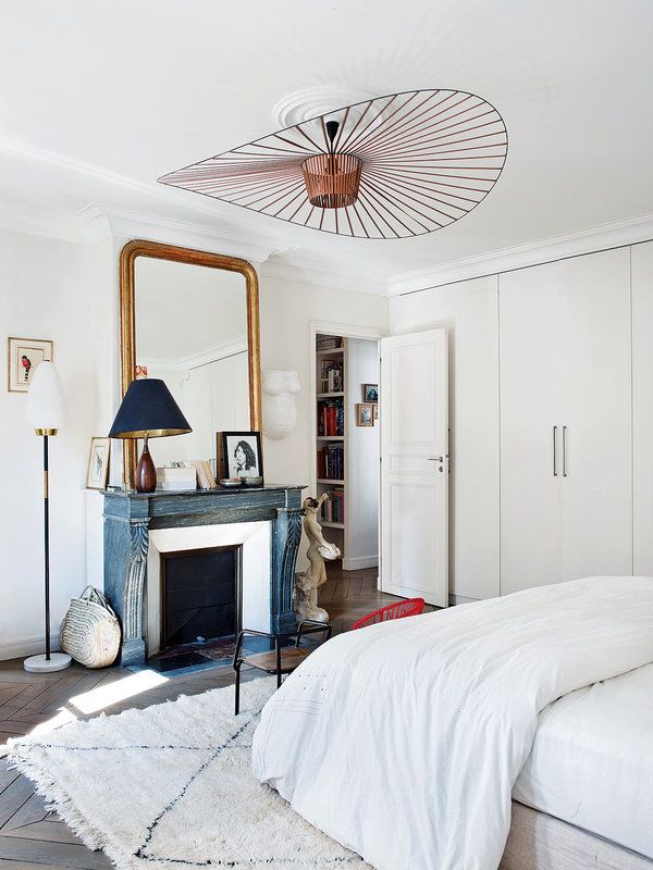 Parisian bedroom with Moroccan rug via Nuevo Estilo Caroline Gayral