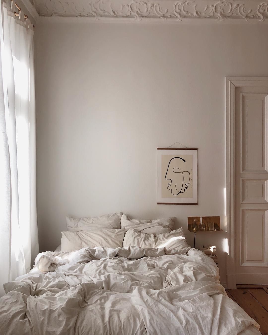 Parisian bedroom with minimalist wall art via @franzibower