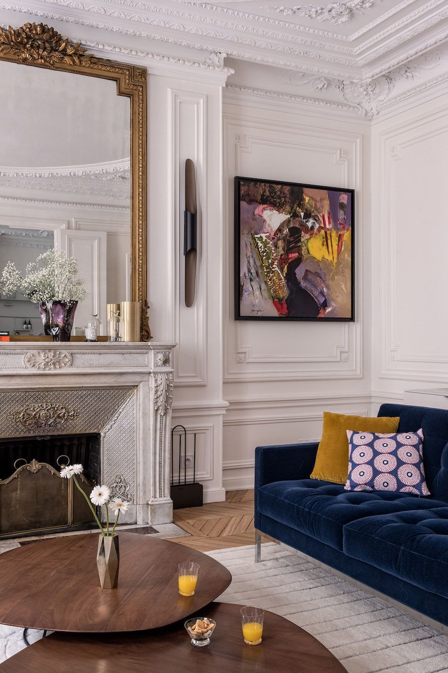 Parisian living room blue velvet sofa via Veronique Cotrel