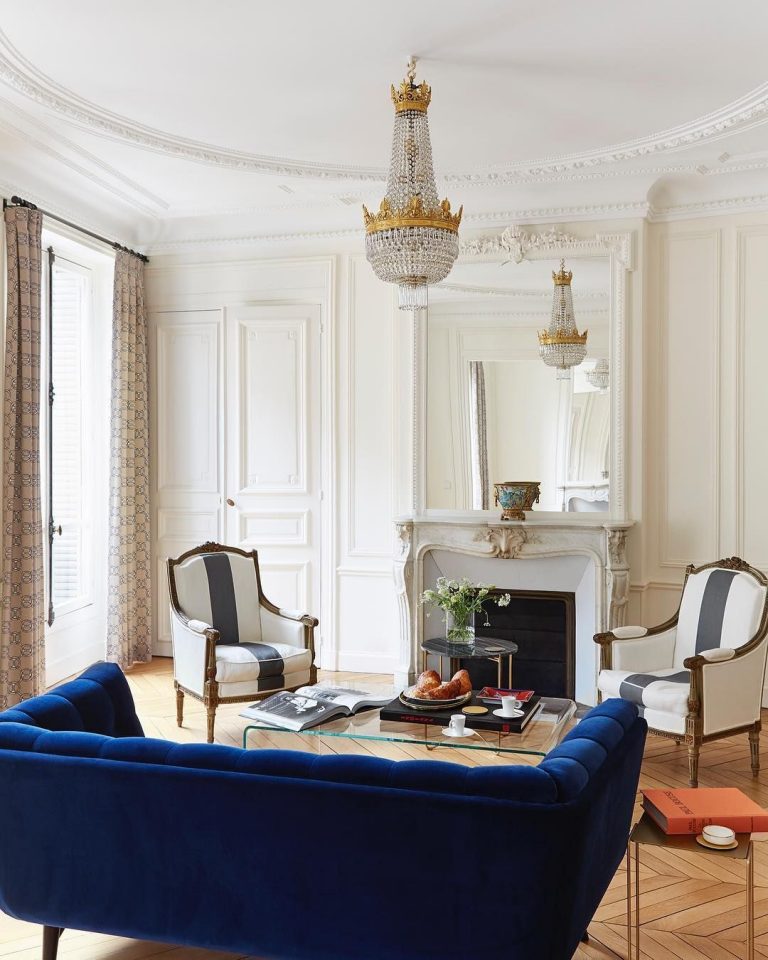 Parisian Living Room With Blue Velvet Sofa And Crystal Chandelier Via @abkasha 768x960 