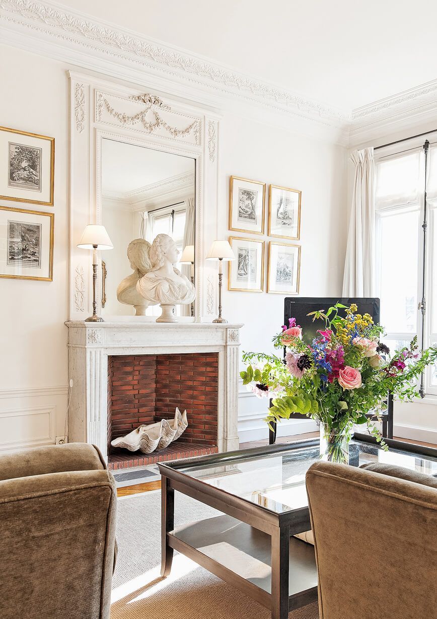 Parisian living room with bust on fireplace