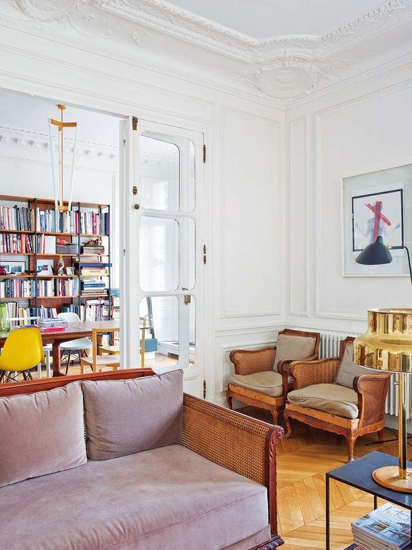 Parisian living room with cane paneled sofa via Nuevo Estilo Delphine de Canecaude