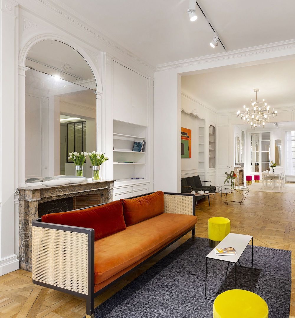 Parisian living room with cane sofa via Havenin Saint Honore