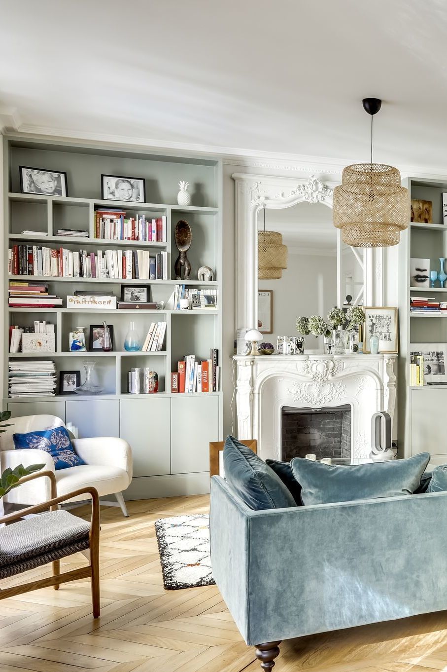 Parisian living room with faded blue sofa 2 via CoteMaison Studio 85 By Casaromani et Conscience